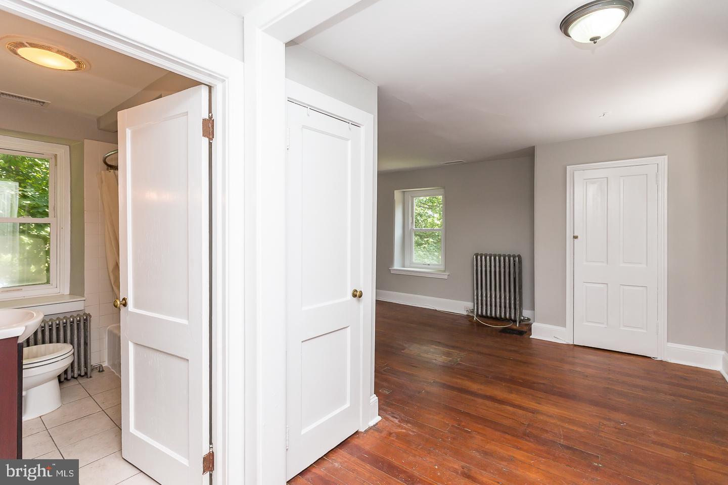 337 Righters Mill Road Gladwyne, PA 19035 - Photo 23 of 41 a view of an empty room with a window and wooden floor