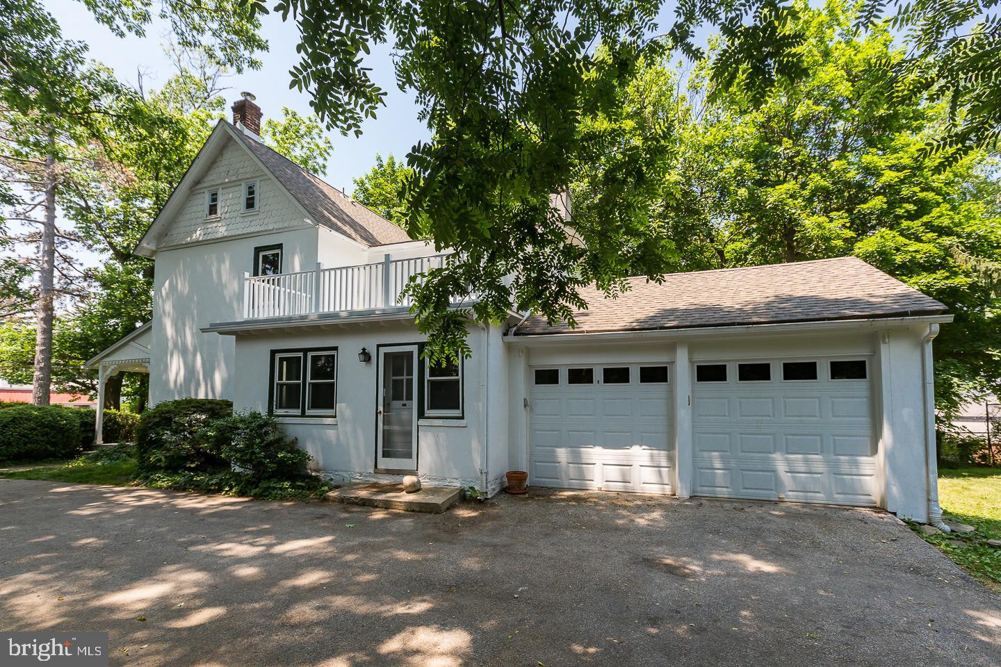 337 Righters Mill Road Gladwyne, PA 19035 - Photo 4 of 41 a front view of a house with a garden