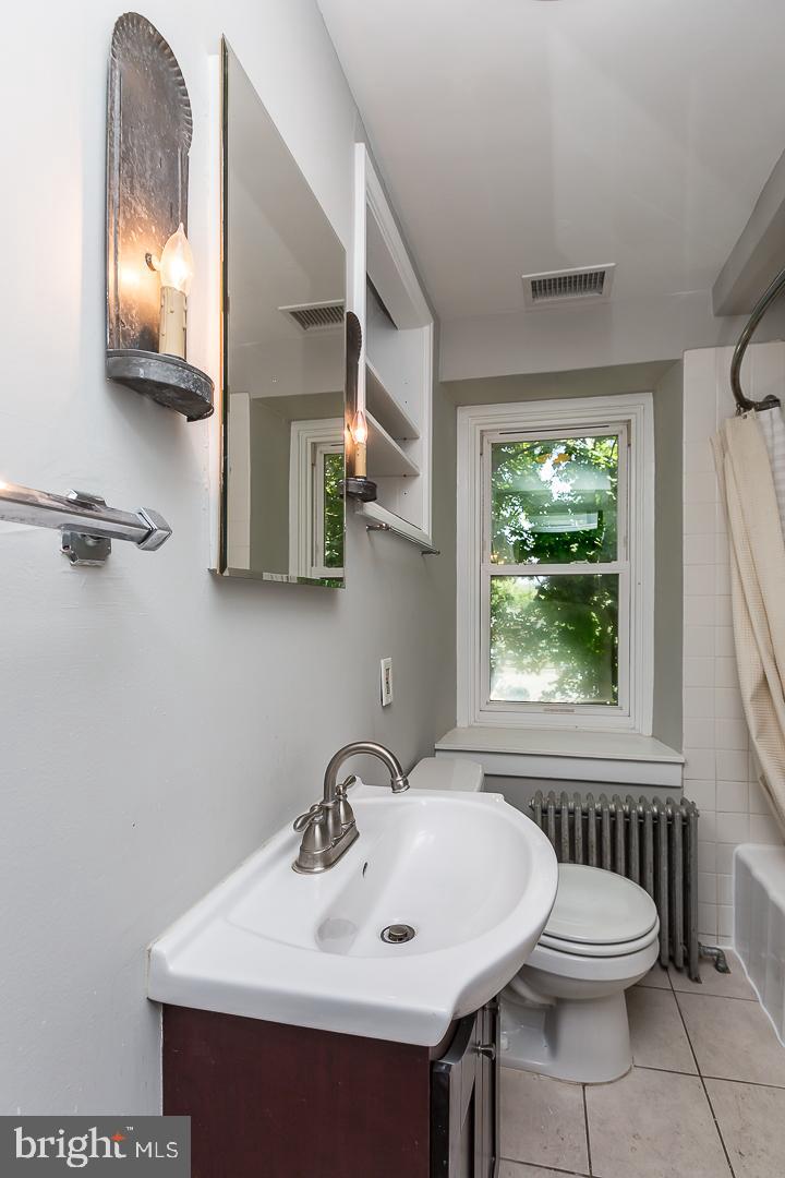 337 Righters Mill Road Gladwyne, PA 19035 - Photo 34 of 41 a bathroom with a sink and a mirror