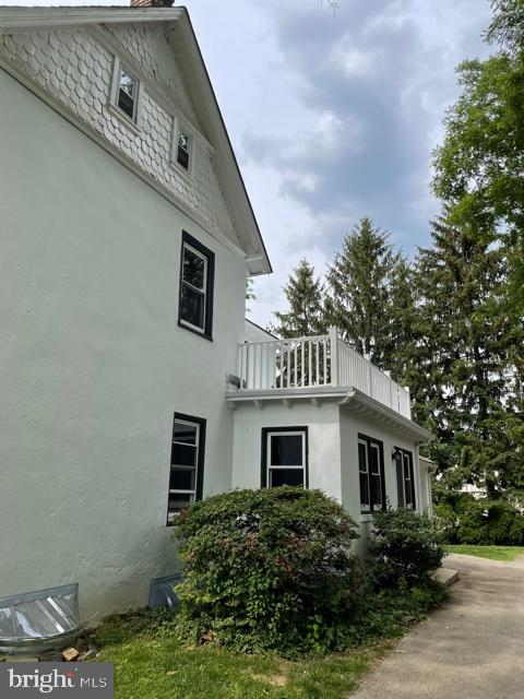 337 Righters Mill Road Gladwyne, PA 19035 - Photo 37 of 41 a front view of a house with garden