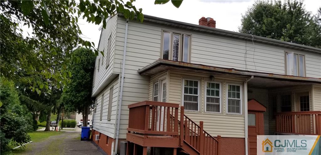 901 A Hermann Road North Brunswick, NJ 08902 - Photo 2 of 21 a front view of a house with a tree