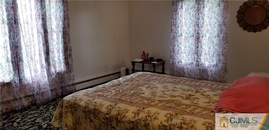 901 A Hermann Road North Brunswick, NJ 08902 - Photo 11 of 21 a bedroom with a bed and a window