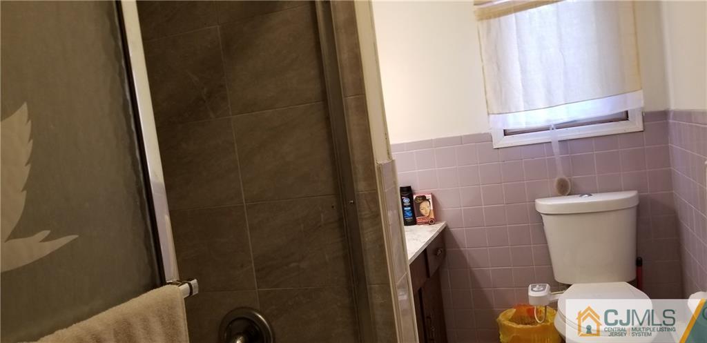 901 A Hermann Road North Brunswick, NJ 08902 - Photo 16 of 21 a bathroom with a sink and a toilet