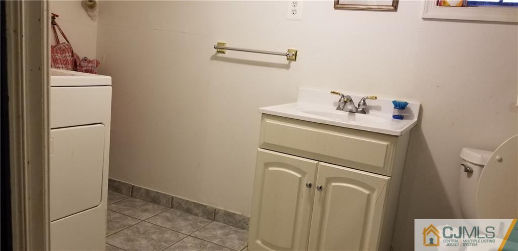 901 A Hermann Road North Brunswick, NJ 08902 - Photo 17 of 21 a utility room with dryer and washer