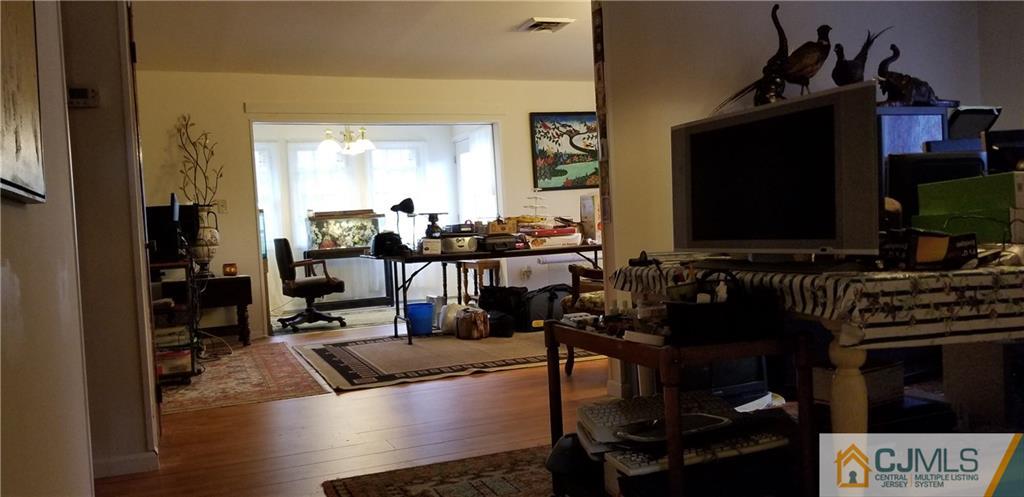 901 A Hermann Road North Brunswick, NJ 08902 - Photo 5 of 21 a living room with furniture and a flat screen tv