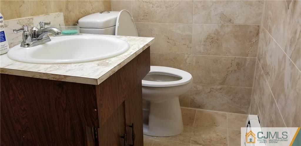 901 A Hermann Road North Brunswick, NJ 08902 - Photo 8 of 21 a bathroom with a sink and a toilet