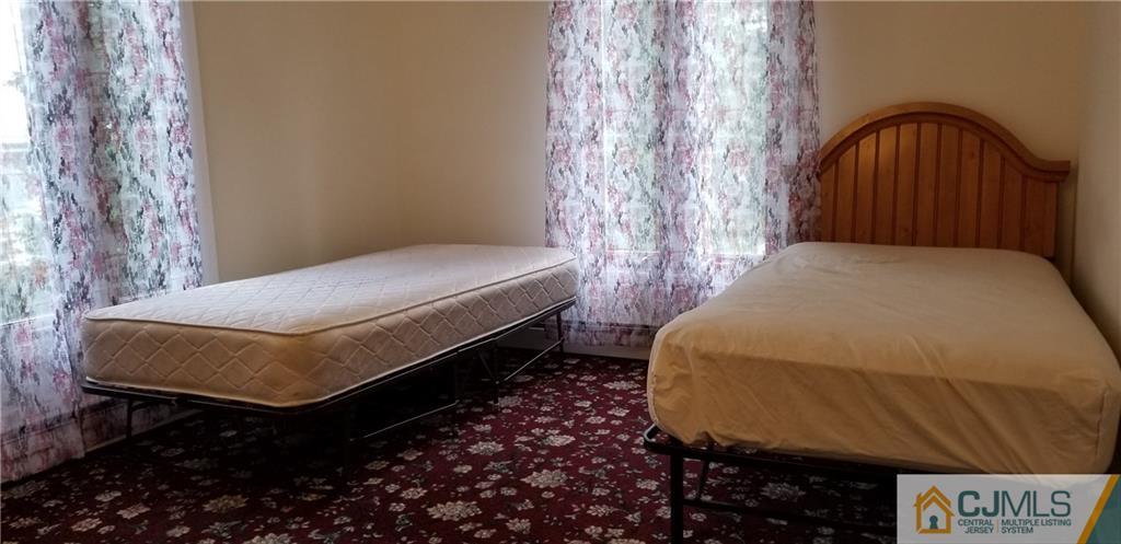 901 A Hermann Road North Brunswick, NJ 08902 - Photo 9 of 21 a bedroom with a bed and a window