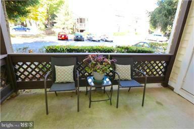 10169 Oakton Terrace Road, Unit 10169 Oakton, VA 22124 - Photo 11 of 14 a balcony with table and chairs
