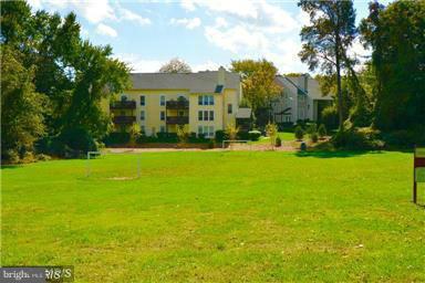 10169 Oakton Terrace Road, Unit 10169 Oakton, VA 22124 - Photo 12 of 14 a view of swimming pool is middle in the garden
