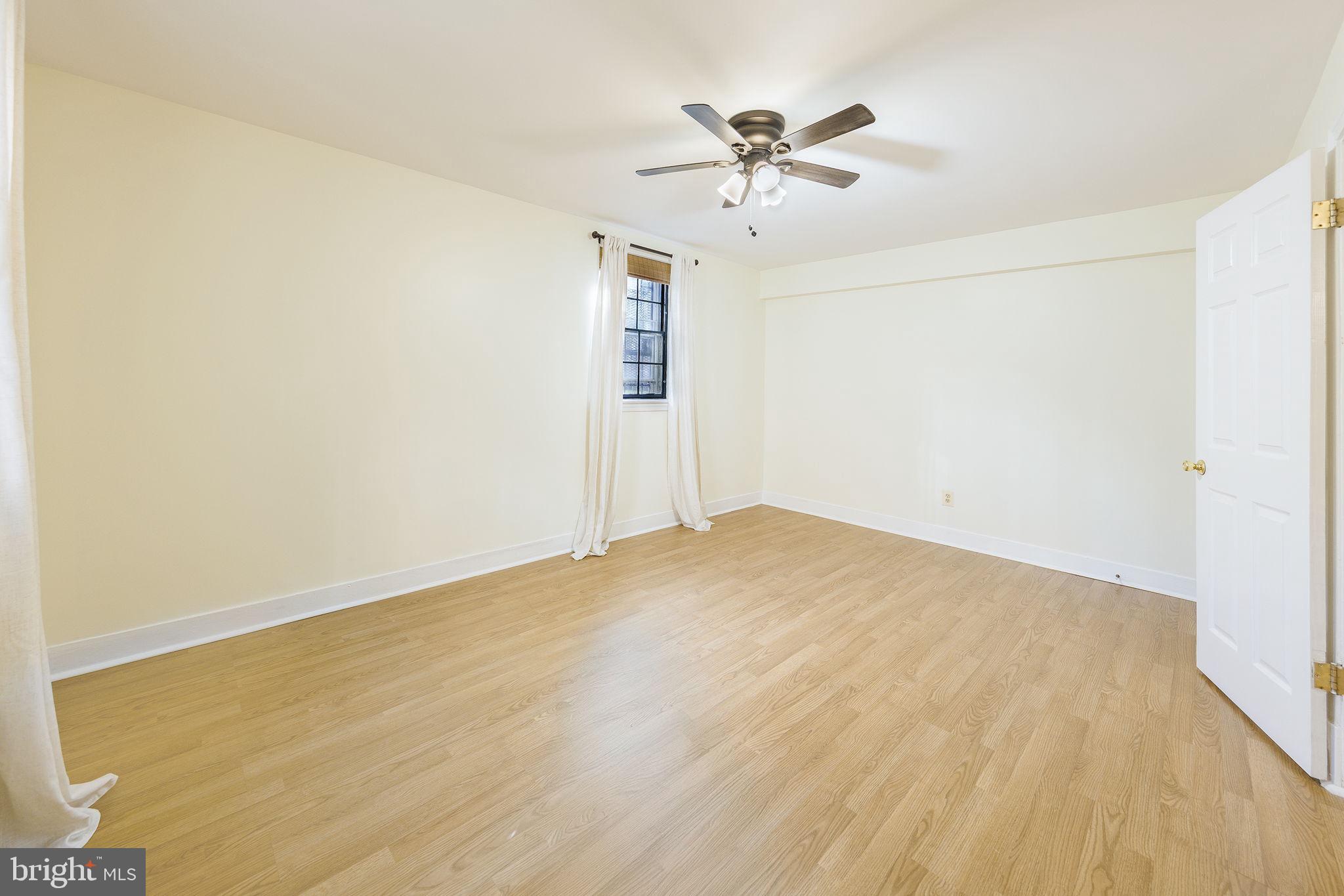 1446 Tuckerman Street Northwest, Unit A6 Washington, DC 20011 - Photo 15 of 25 a view of empty room with wooden floor