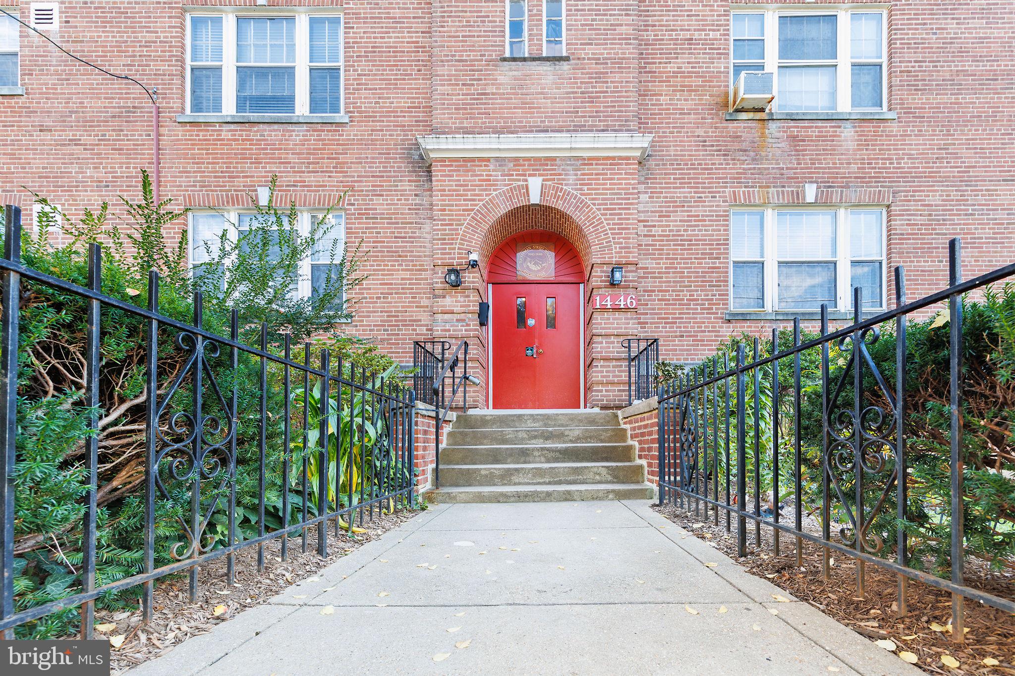 1446 Tuckerman Street Northwest, Unit A6 Washington, DC 20011 - Photo 23 of 25 a front view of a house with plants