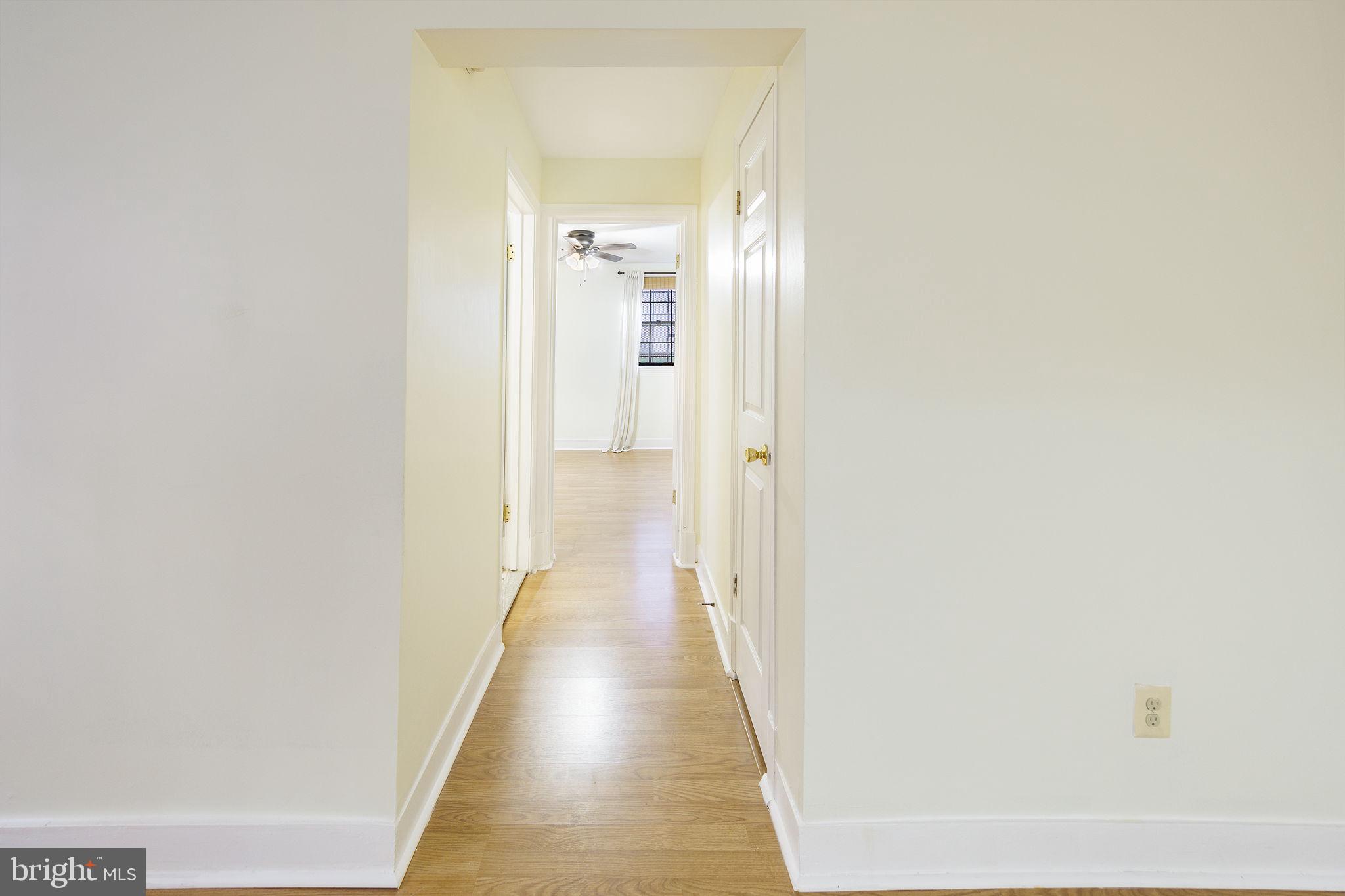 1446 Tuckerman Street Northwest, Unit A6 Washington, DC 20011 - Photo 3 of 25 a view of a hallway with wooden floor