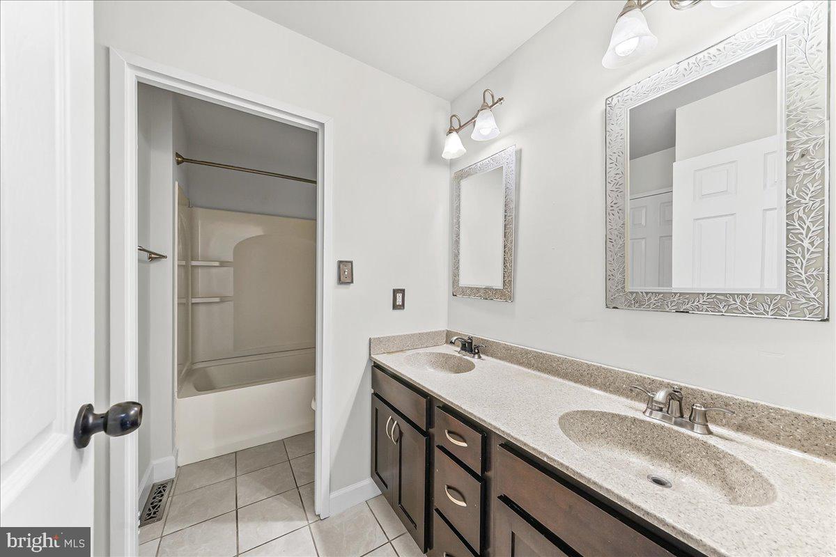 54 Norwood House Road, Unit 34 Downingtown, PA 19335 - Photo 16 of 21 a bathroom with a sink double vanity and a mirror