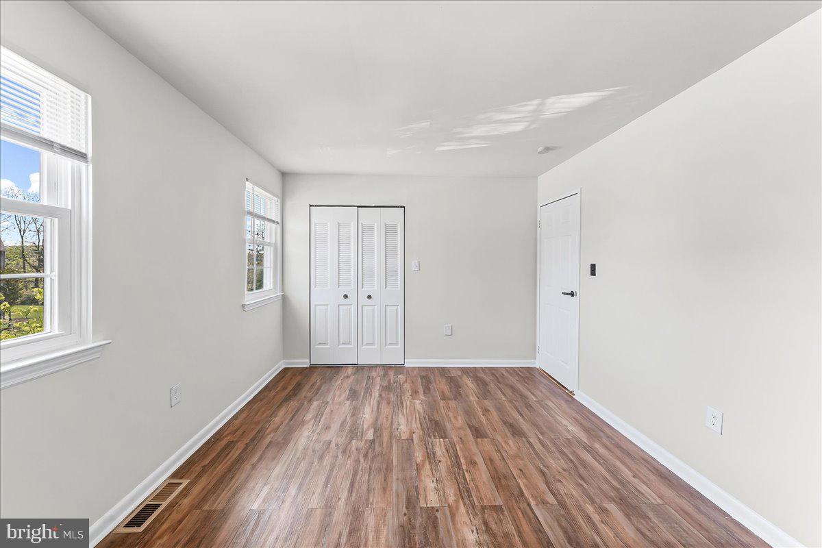 54 Norwood House Road, Unit 34 Downingtown, PA 19335 - Photo 18 of 21 a view of a room with wooden floor and windows
