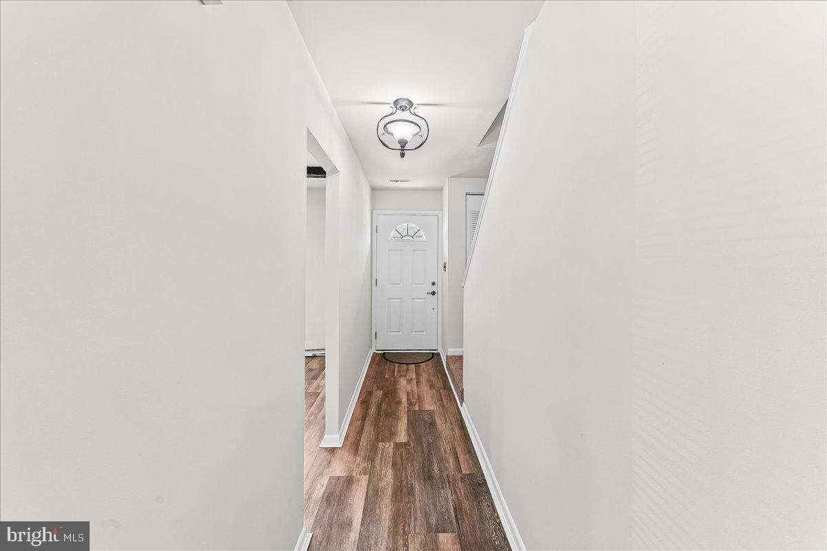 54 Norwood House Road, Unit 34 Downingtown, PA 19335 - Photo 2 of 21 a view of a hallway with wooden floor