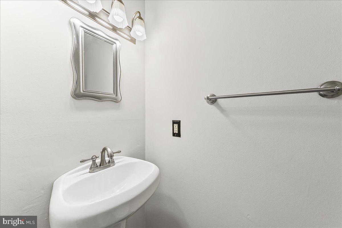 54 Norwood House Road, Unit 34 Downingtown, PA 19335 - Photo 7 of 21 a bathroom with a sink a mirror and vanity