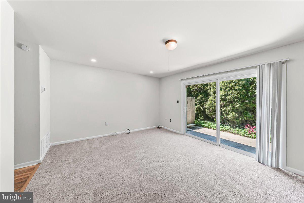 54 Norwood House Road, Unit 34 Downingtown, PA 19335 - Photo 8 of 21 a view of an empty room with wooden floor and a window