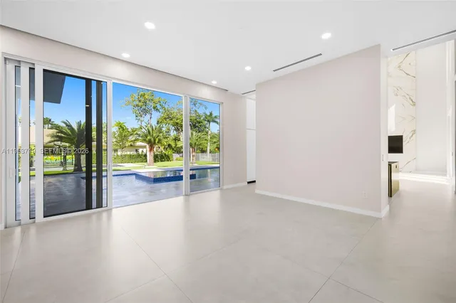 a view of livingroom with floor to ceiling window and wooden floor