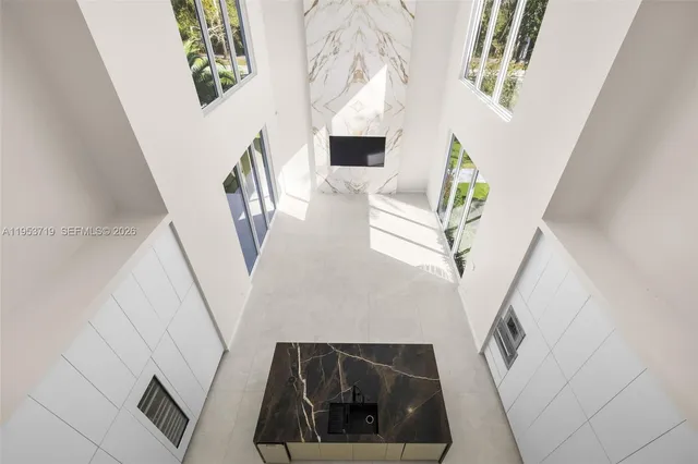 a view of entryway and kitchen