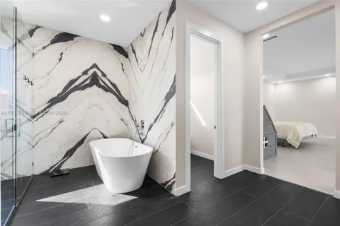 a bathroom with a toilet and a bathtub