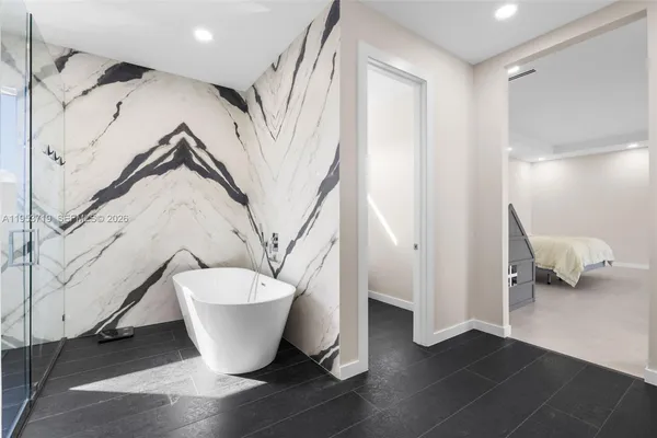 a bathroom with a toilet and a bathtub