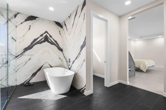 a bathroom with a toilet and a bathtub