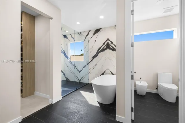 a bathroom with a double vanity sink and mirror