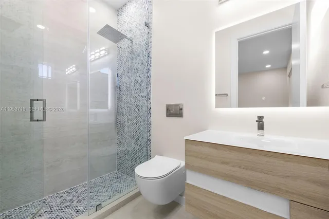 a spacious bedroom with a bed and large window