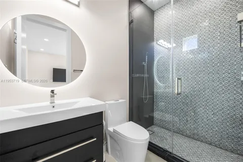 a bedroom with two beds and a window