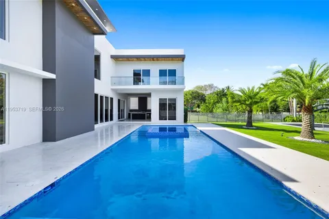 a view of a house with a swimming pool