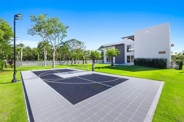 an aerial view of residential houses with outdoor space and street view