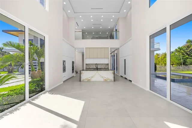 a view of an empty room and glass door