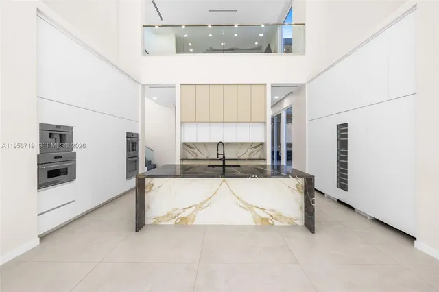 a view of living room filled with furniture and window