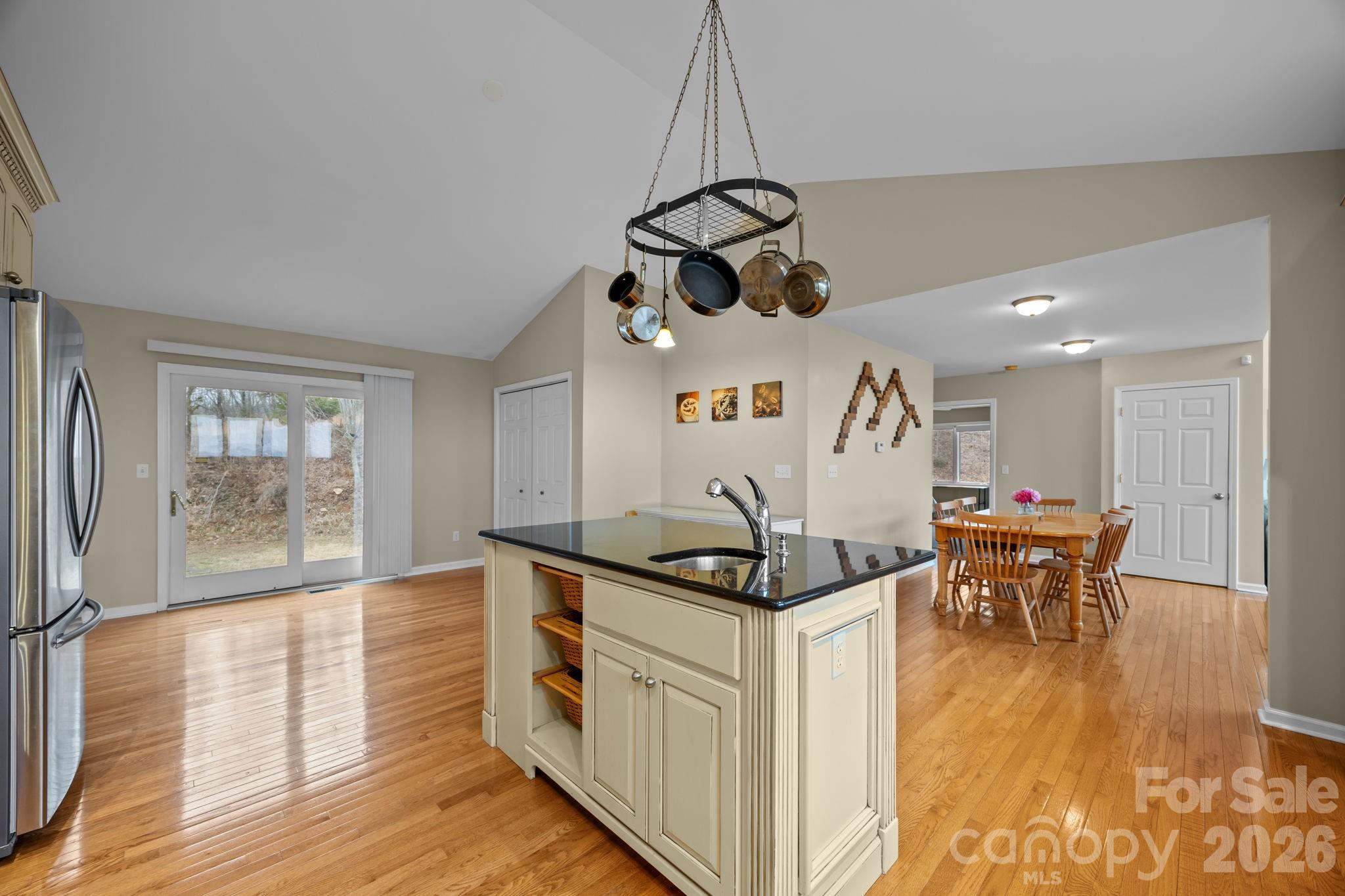 995 Towery Trace Road Ellenboro, NC 28040 - Photo 21 of 40 a kitchen with stainless steel appliances granite countertop a sink and wooden floor