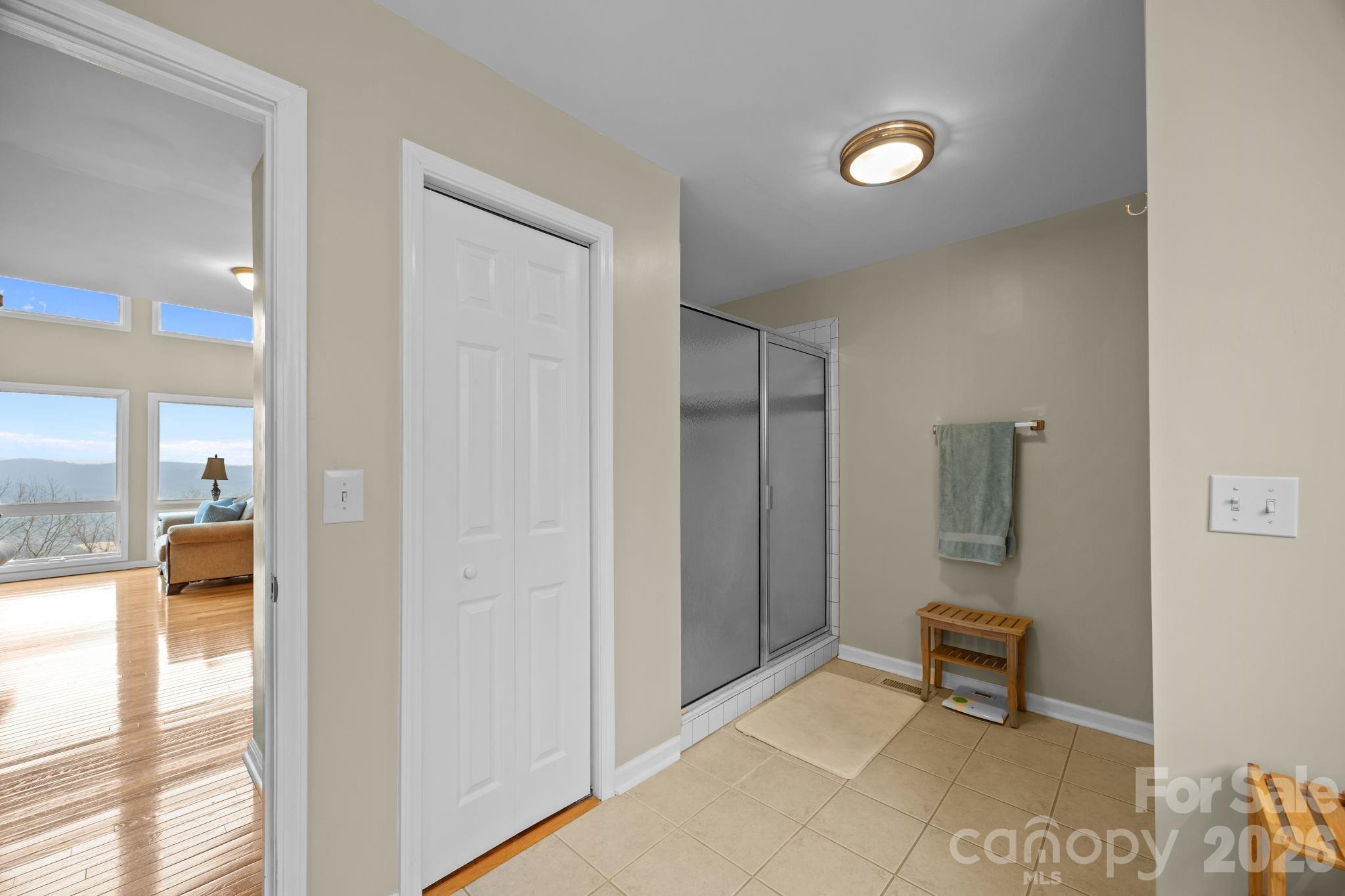 995 Towery Trace Road Ellenboro, NC 28040 - Photo 26 of 40 a hallway with a bench and a mirror