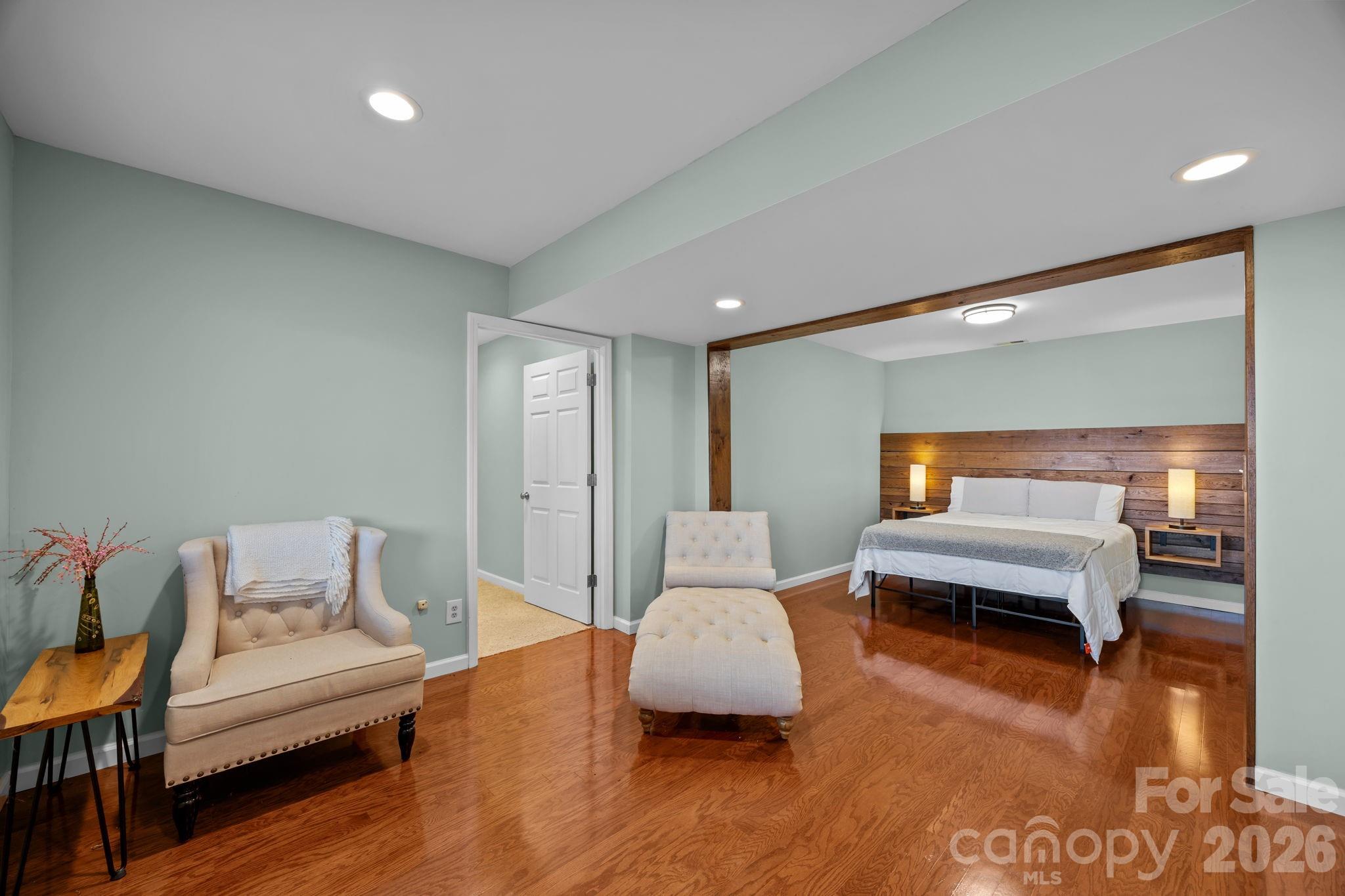 995 Towery Trace Road Ellenboro, NC 28040 - Photo 33 of 40 a bedroom with furniture and wooden floor