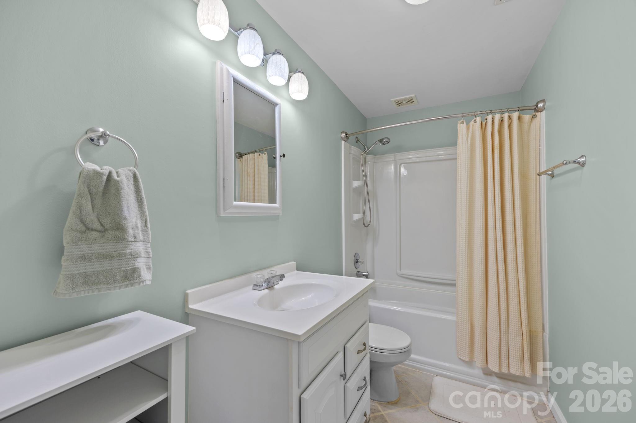 995 Towery Trace Road Ellenboro, NC 28040 - Photo 34 of 40 a bathroom with a sink a toilet and shower