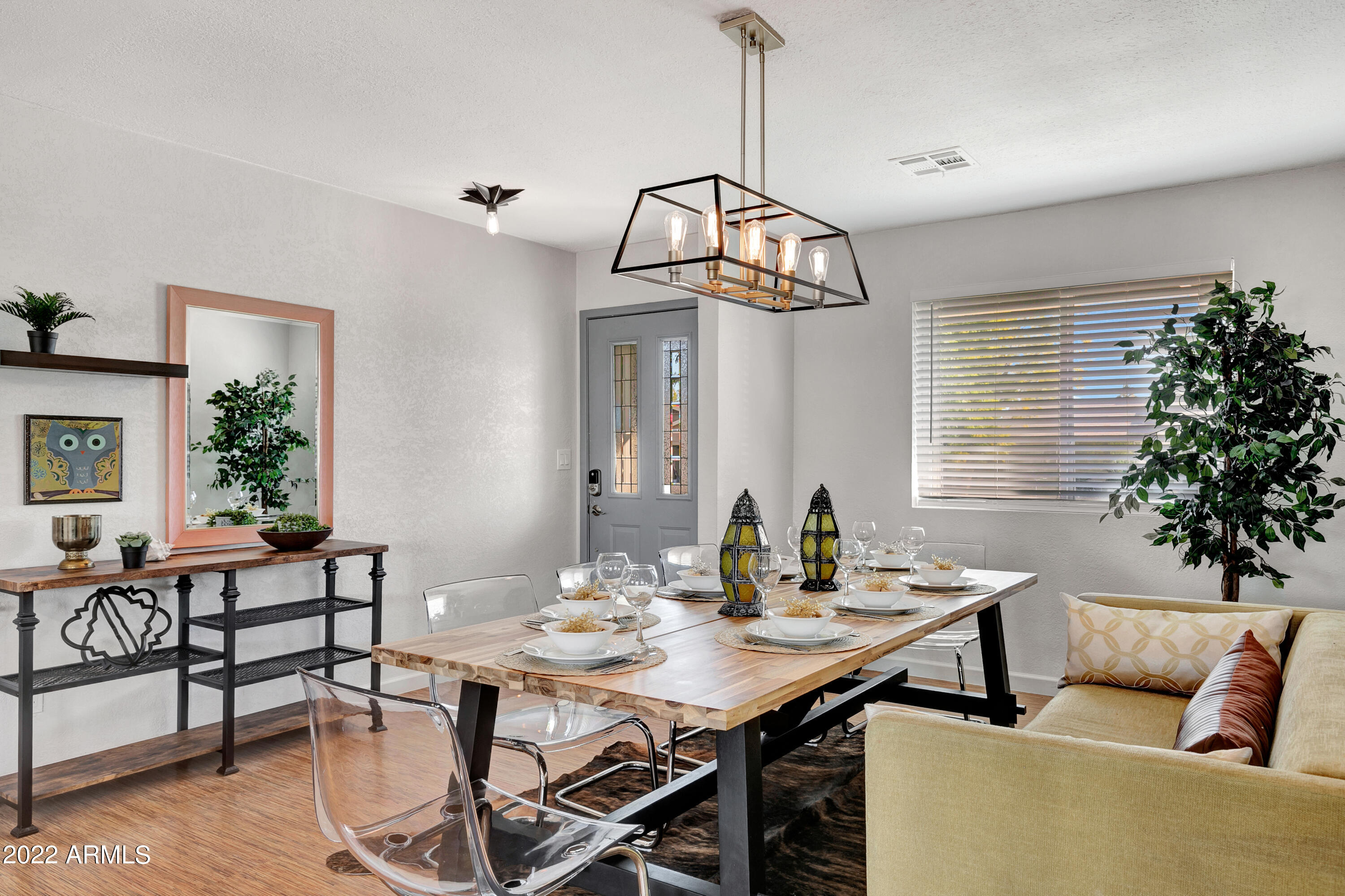 a view of a dining room with furniture window and wooden floor