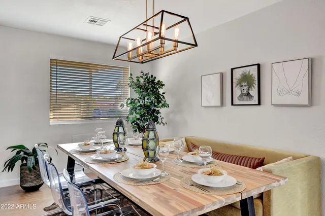 a view of a dining room with furniture window and outside view