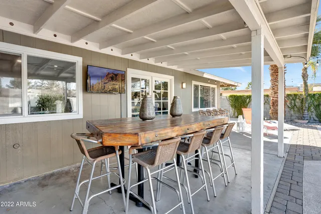 a dining room with furniture and window