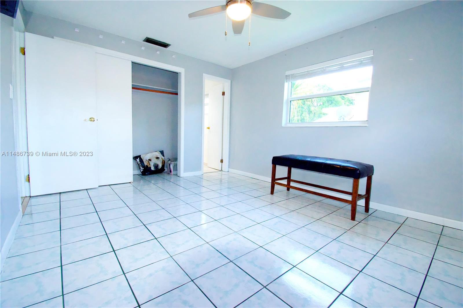6560 Northwest 30th Street Sunrise, FL 33313 - Photo 11 of 46 a view of an empty room with window and chandelier fan