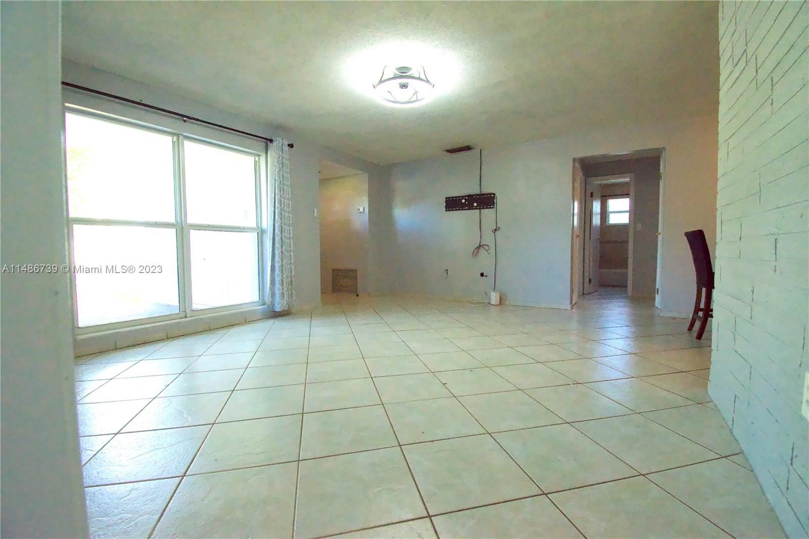 6560 Northwest 30th Street Sunrise, FL 33313 - Photo 16 of 46 a view of an empty room with a window