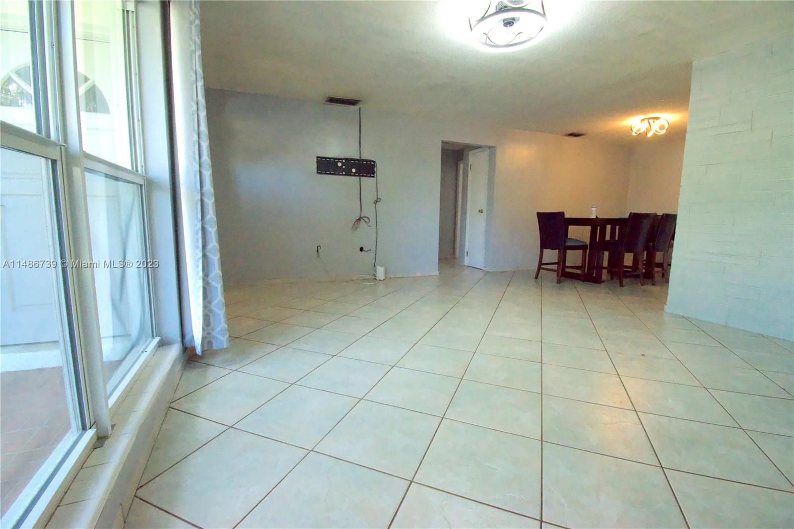 6560 Northwest 30th Street Sunrise, FL 33313 - Photo 17 of 46 a view of a livingroom with furniture and an entryway