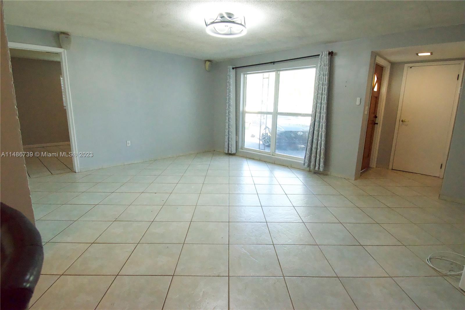6560 Northwest 30th Street Sunrise, FL 33313 - Photo 19 of 46 a view of an empty room and window