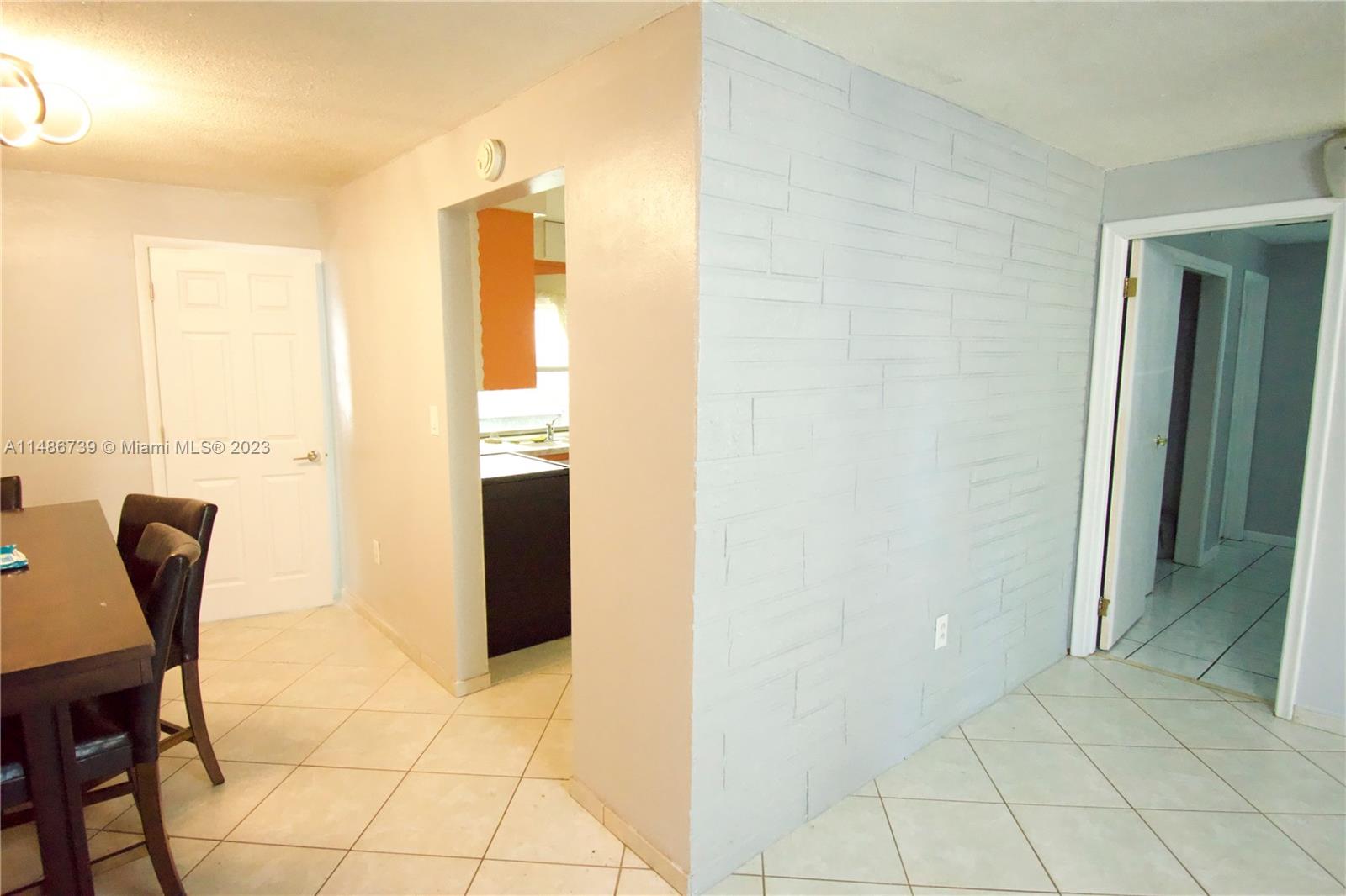 6560 Northwest 30th Street Sunrise, FL 33313 - Photo 20 of 46 a view of a hallway with furniture and front door
