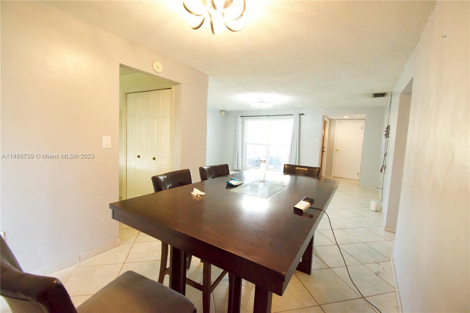 6560 Northwest 30th Street Sunrise, FL 33313 - Photo 24 of 46 a view of a dining room with furniture
