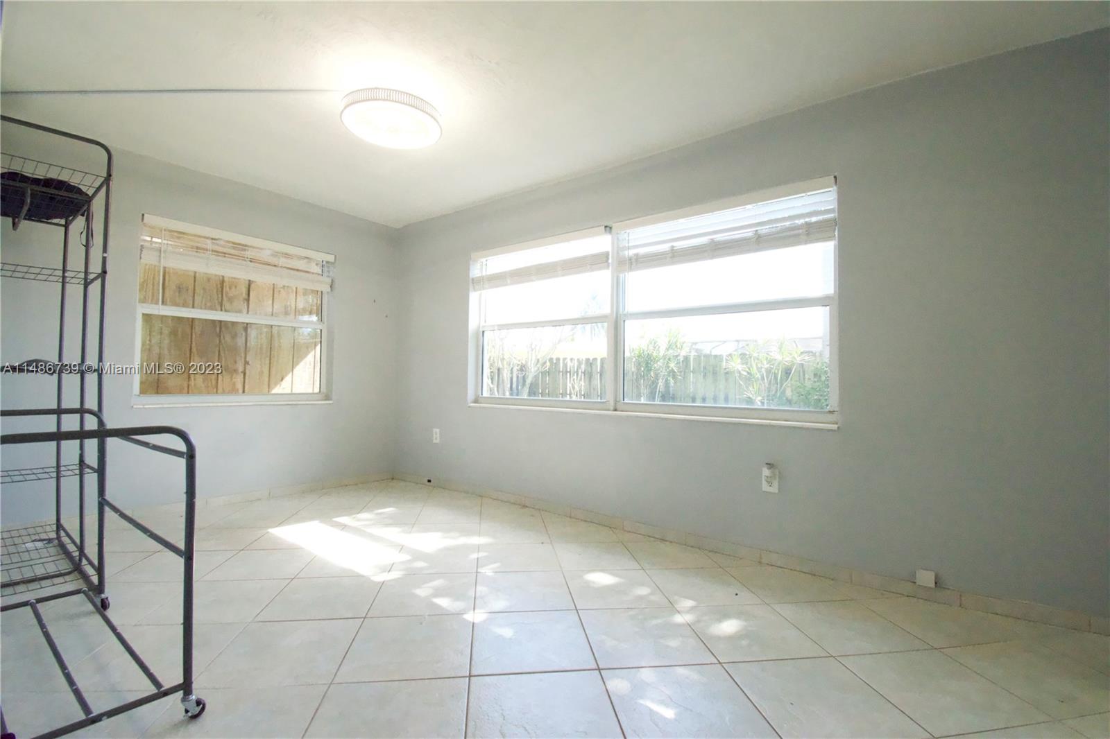 6560 Northwest 30th Street Sunrise, FL 33313 - Photo 27 of 46 a view of an empty room with a window