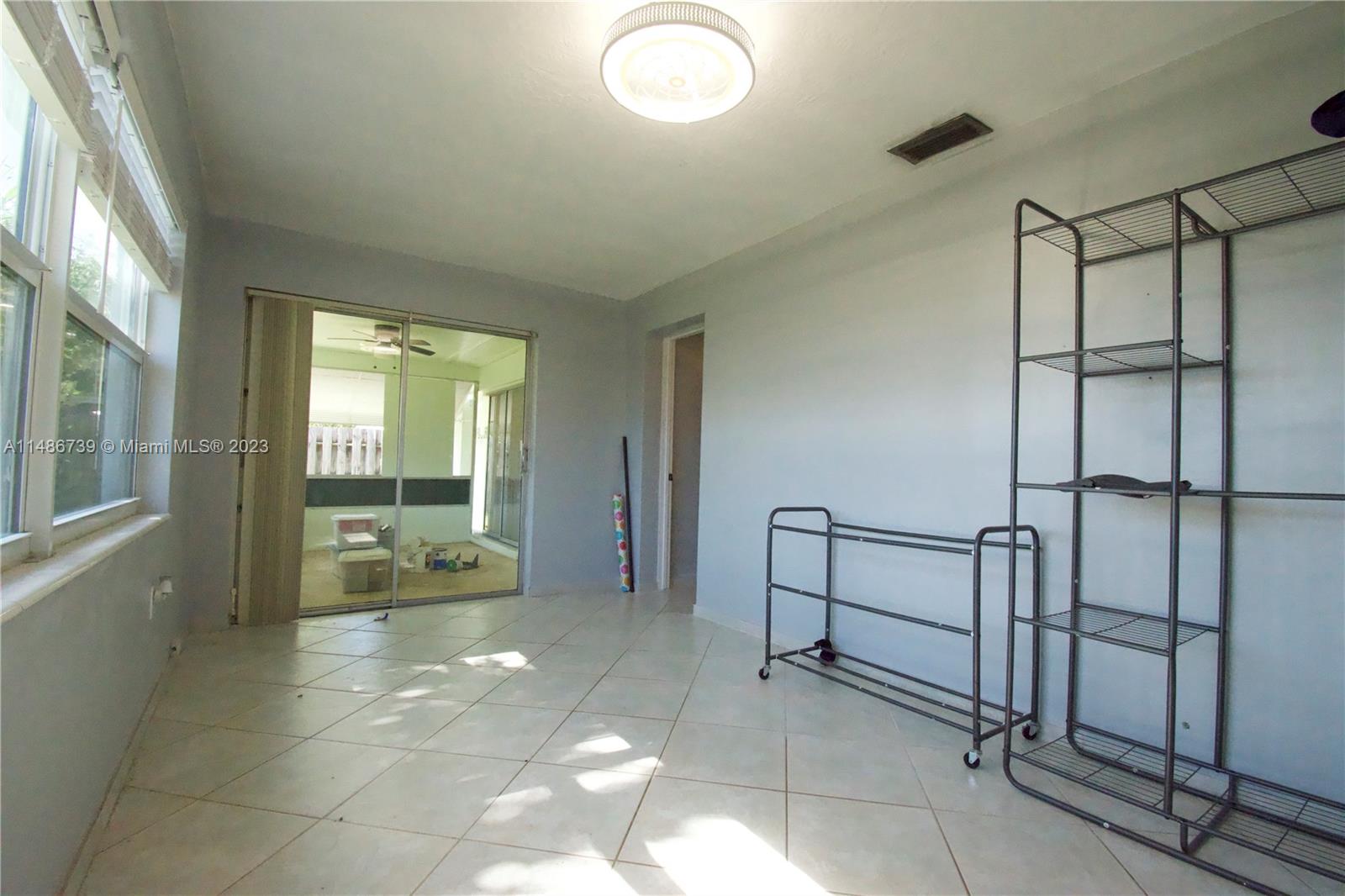 6560 Northwest 30th Street Sunrise, FL 33313 - Photo 30 of 46 a spacious bathroom with a mirror and a shower
