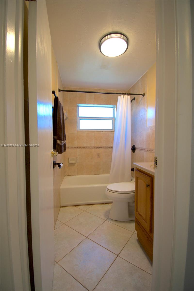 6560 Northwest 30th Street Sunrise, FL 33313 - Photo 35 of 46 a bathroom with a toilet a sink and bathtub
