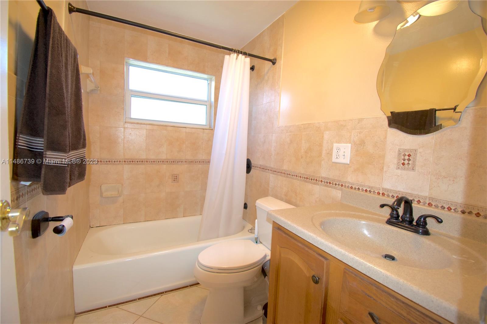 6560 Northwest 30th Street Sunrise, FL 33313 - Photo 36 of 46 a bathroom with a sink toilet and shower